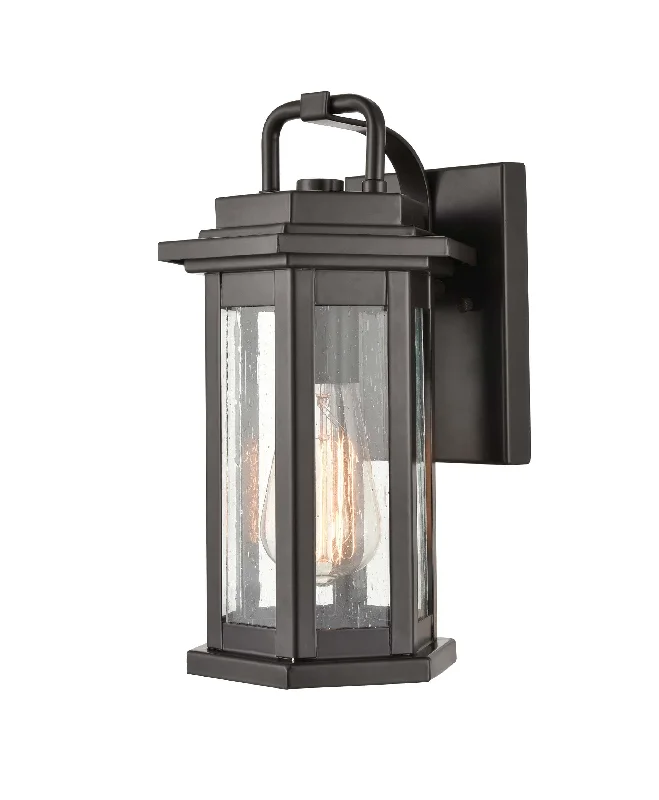 Durable Industrial Lighting for Harsh EnvironmentsEllis Outdoor Wall Sconce - Powder Coat Bronze - Clear Seeded Glass - 7in. Extension - E26 Medium Base Durable Industrial Lighting for Harsh EnvironmentsEllis Outdoor Wall Sconce - Powder Coat Bronze - Clear Seeded Glass - 7in. Extension - E26 Medium Base
