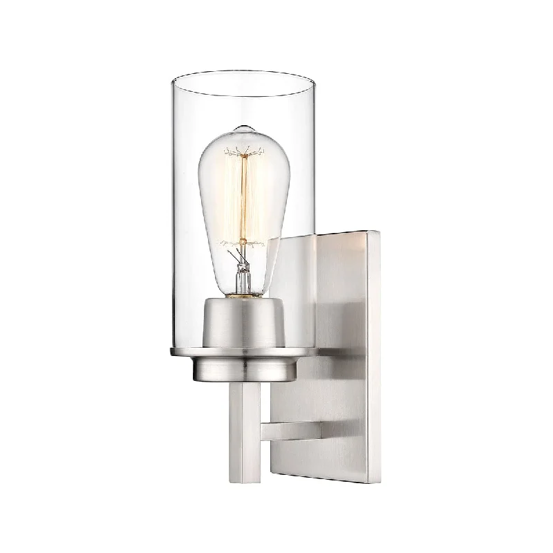 Dust - Resistant Industrial Lighting for Dirty WorkspacesJanna Wall Sconce - Brushed Nickel - Clear Glass - 5in. Extension - E26 Medium Base Dust - Resistant Industrial Lighting for Dirty WorkspacesJanna Wall Sconce - Brushed Nickel - Clear Glass - 5in. Extension - E26 Medium Base